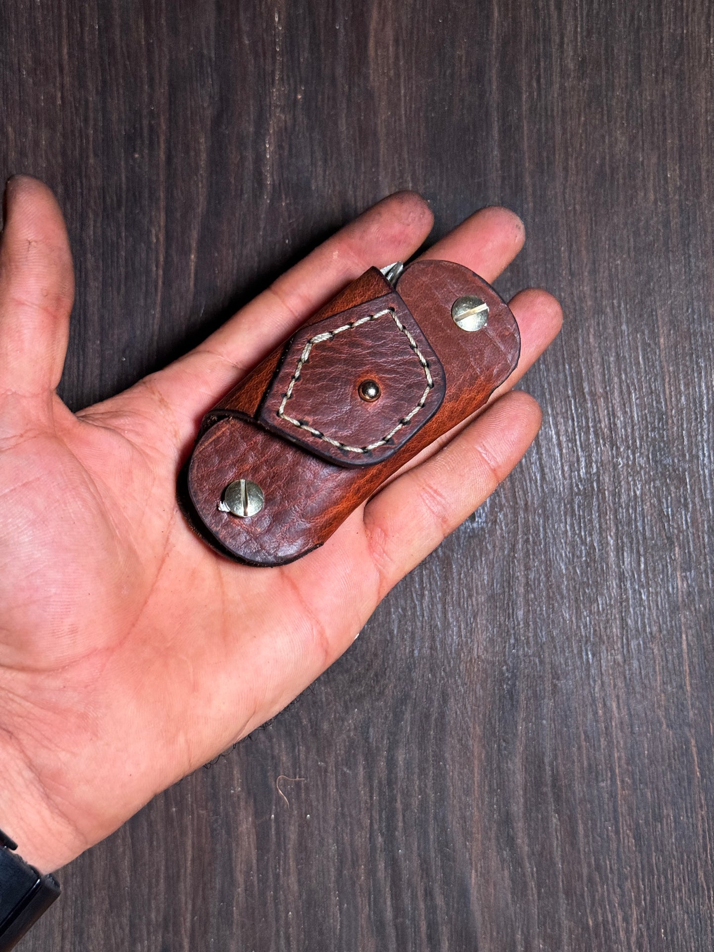 stitched key holder that holds upto 6-8 keys.