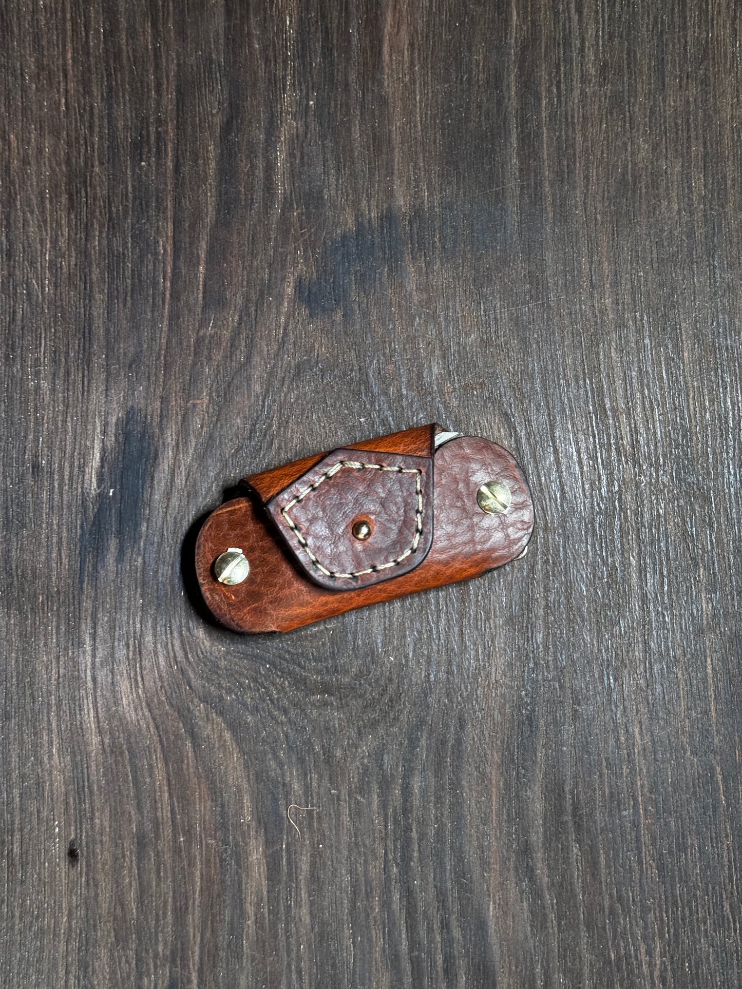 stitched key holder that holds upto 6-8 keys.