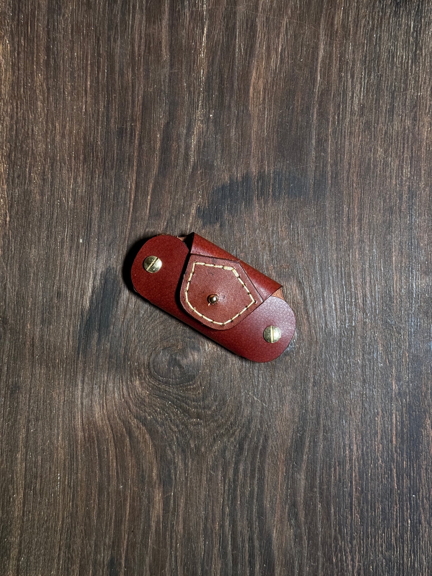 stitched key holder that holds upto 6-8 keys.