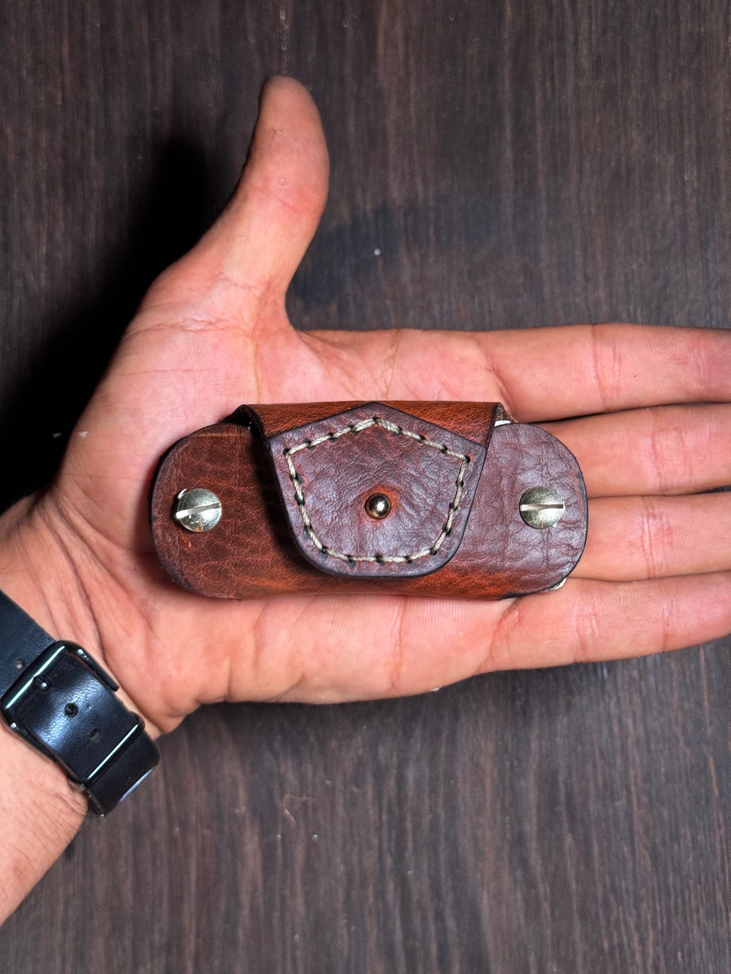 stitched key holder that holds upto 6-8 keys.