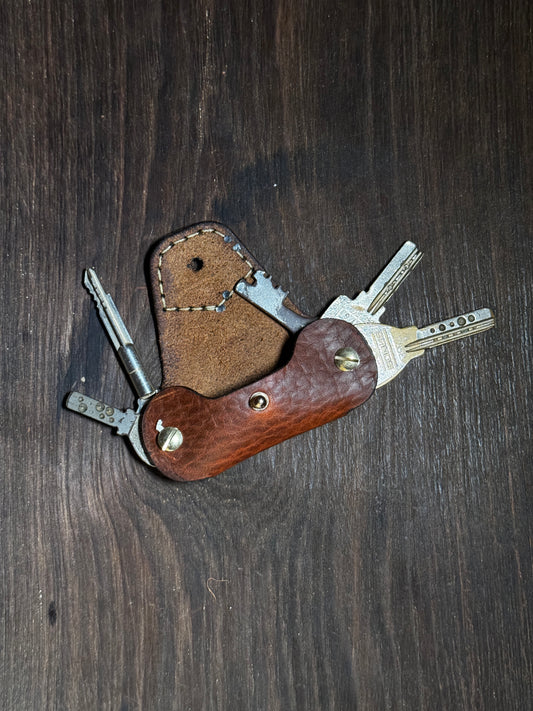 stitched key holder that holds upto 6-8 keys.